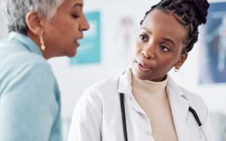 Female doctor talking to person